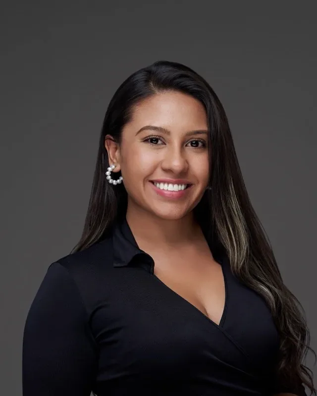 Emily Daza, studio portrait in a black blouse